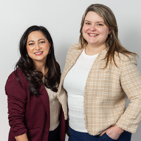 Two women standing facing camera