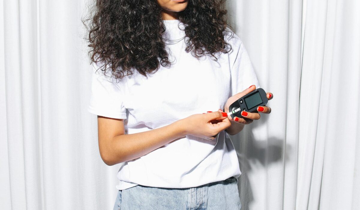 Woman checking blood sugar