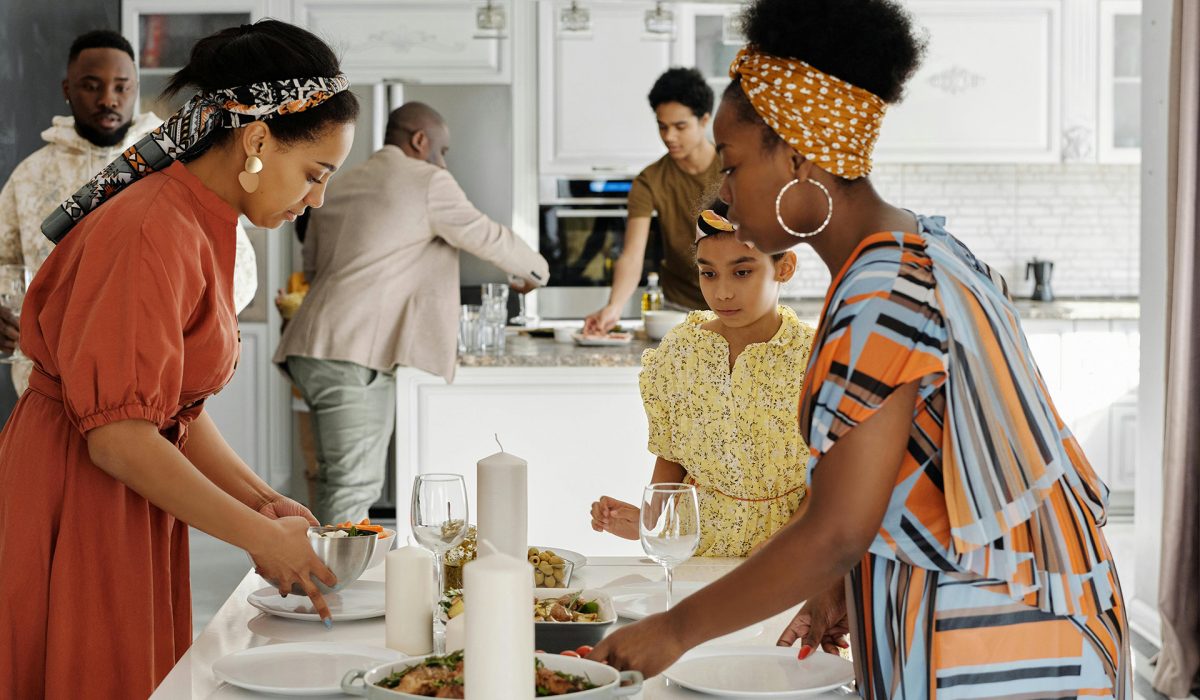 Family setting table for meal