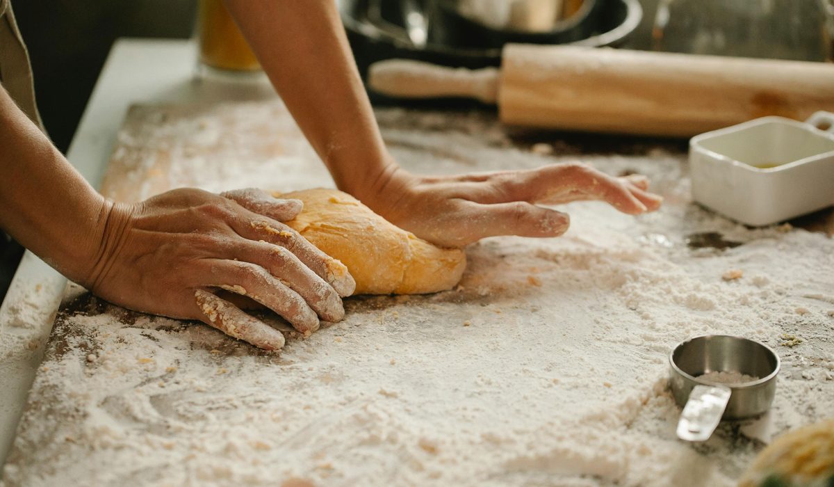 Woman kneading bread