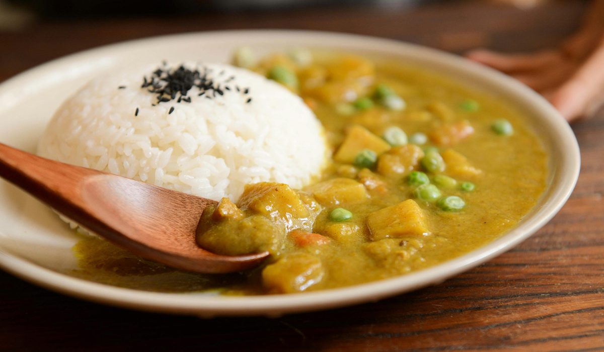Plate of food with rice and soup