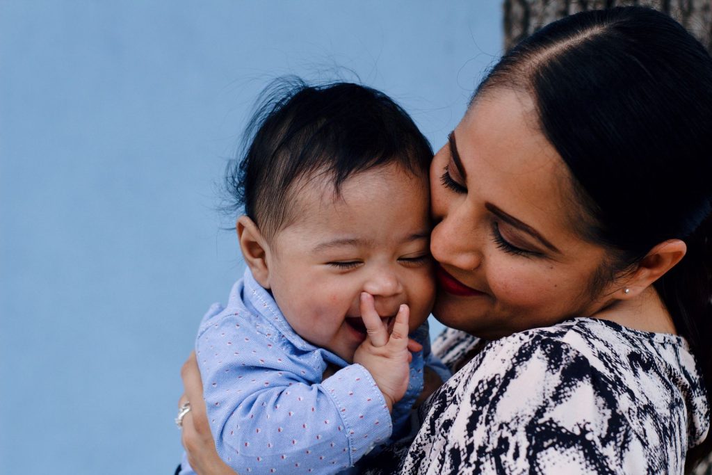 Woman holding baby close to her